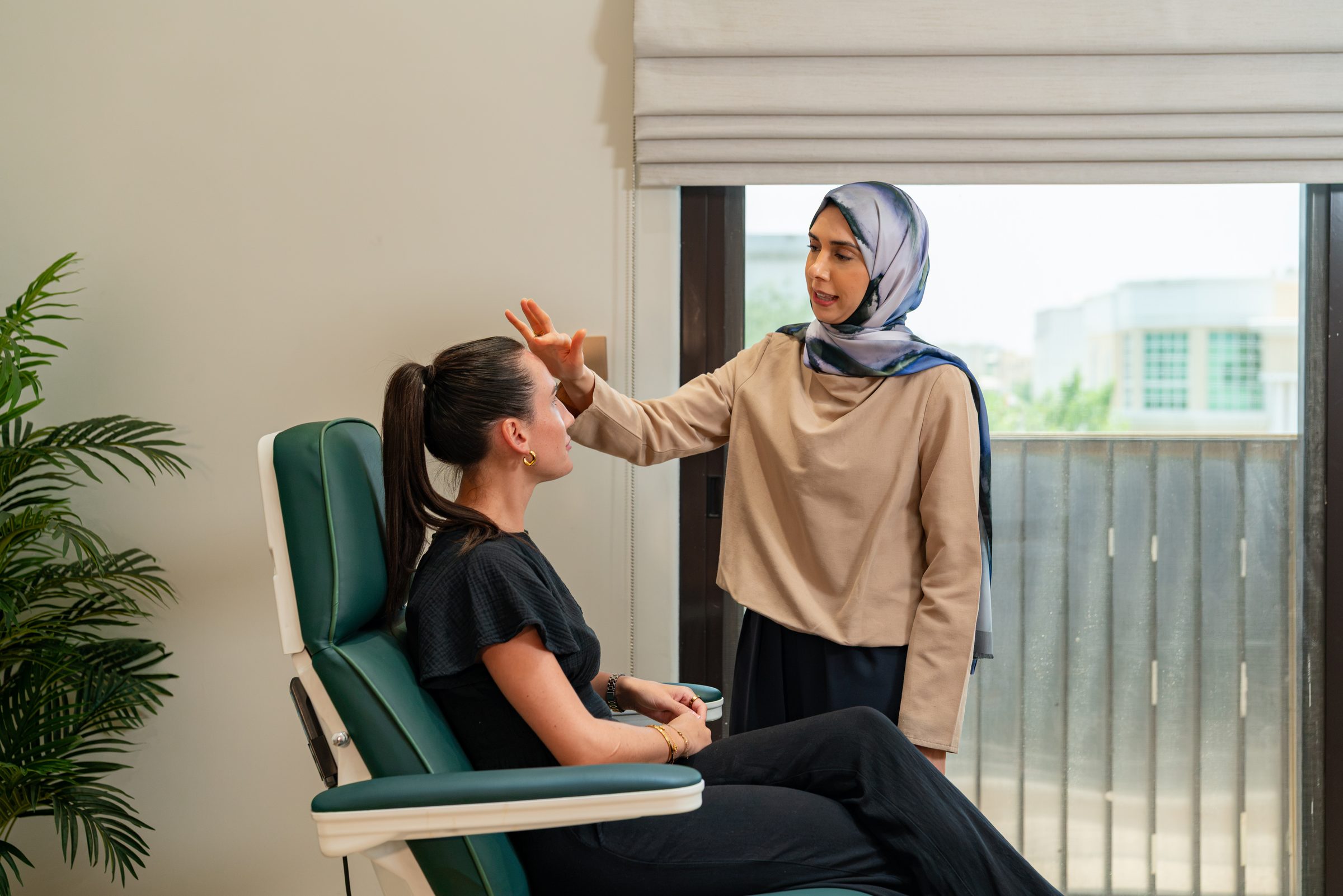 A practitioner with a patient in a treatment chair