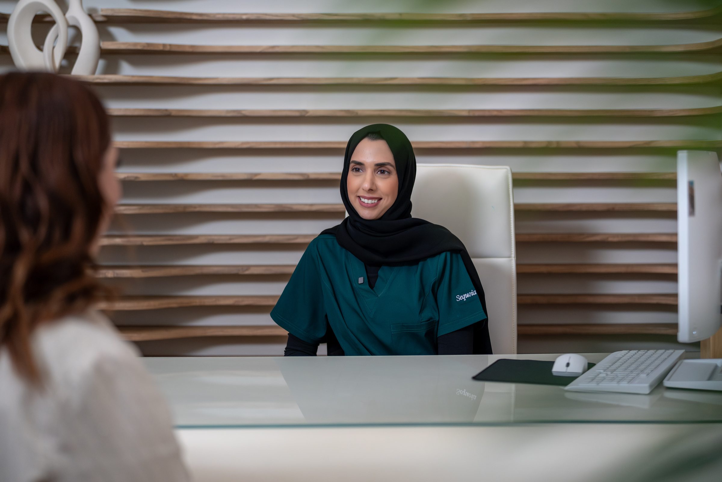 A Sequoia doctor at her desk in a consultation room